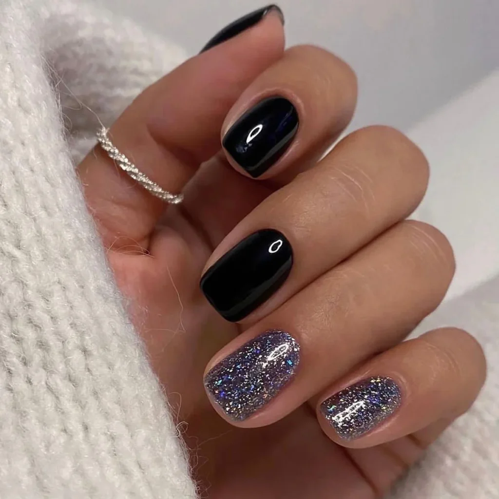 20. Black and Glitter Accent Nails