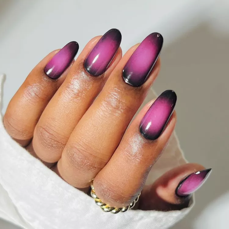 27. Black Nail Art with Metallic Outlines